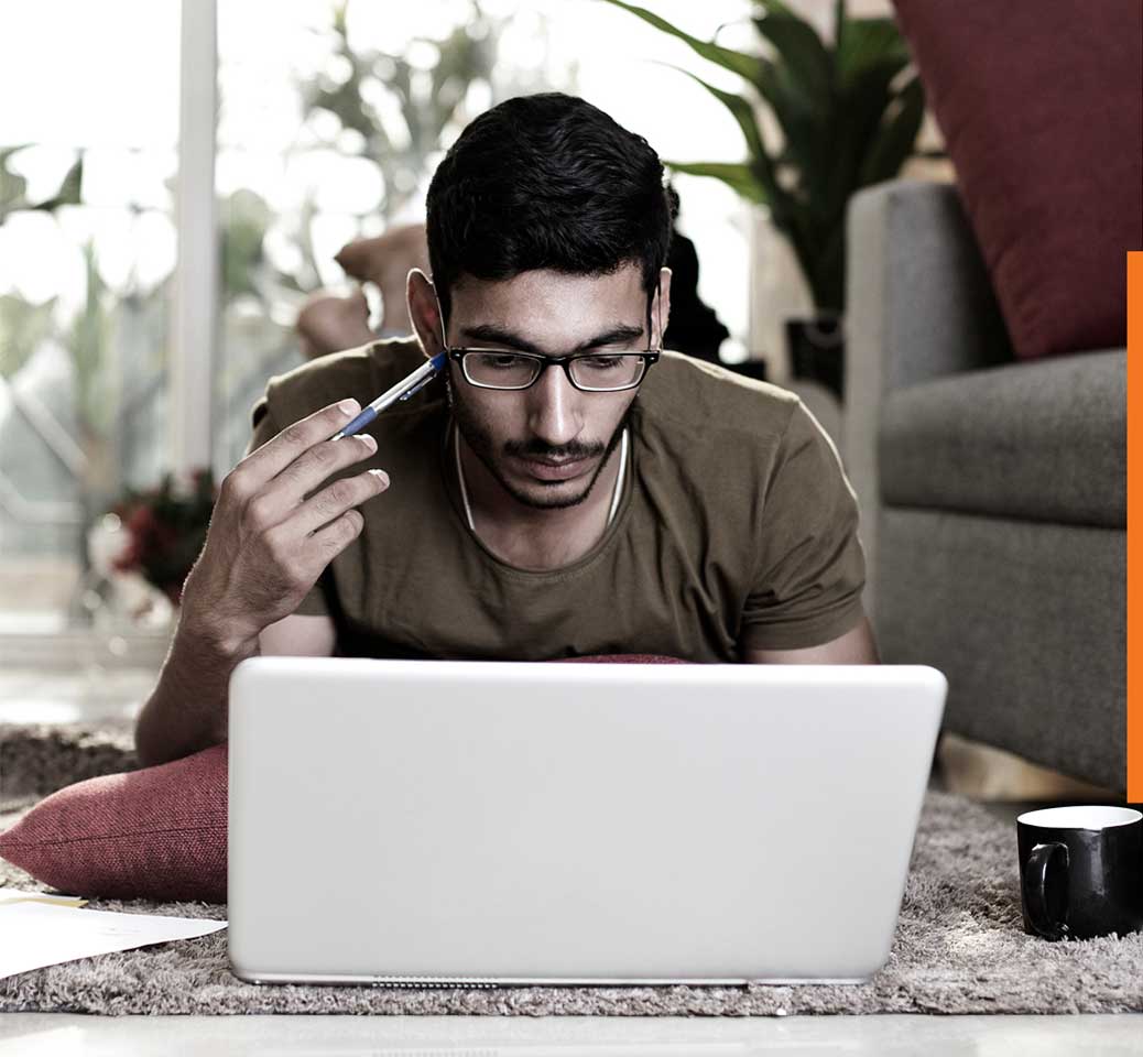 young man looking at laptop