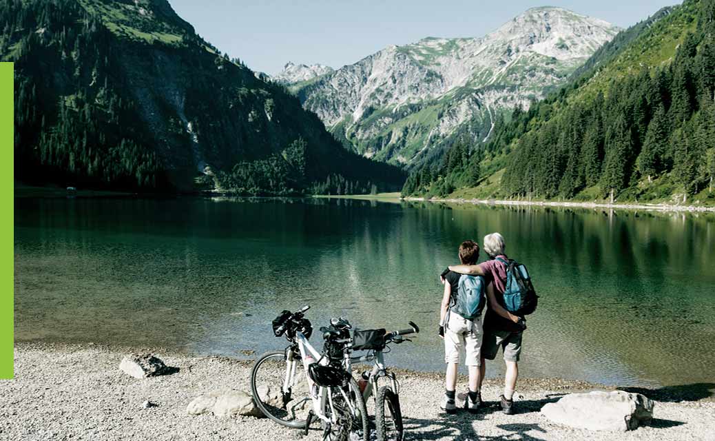 A couple taking a break from biking at the mountains